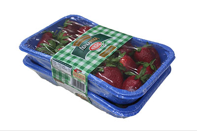 Two bundled packages of strawberries, sealed in plastic and bound with a branded label band.
