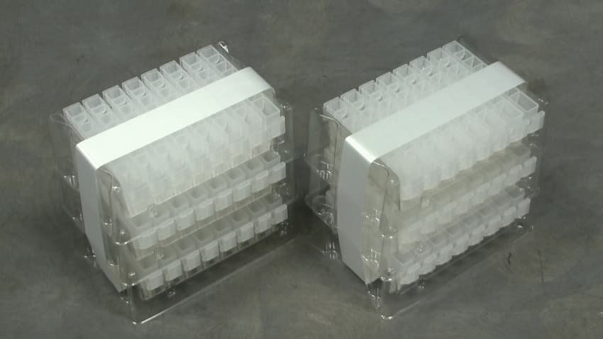 Two stacks of vial trays banded together in three-packs using Felins’ banding technology.