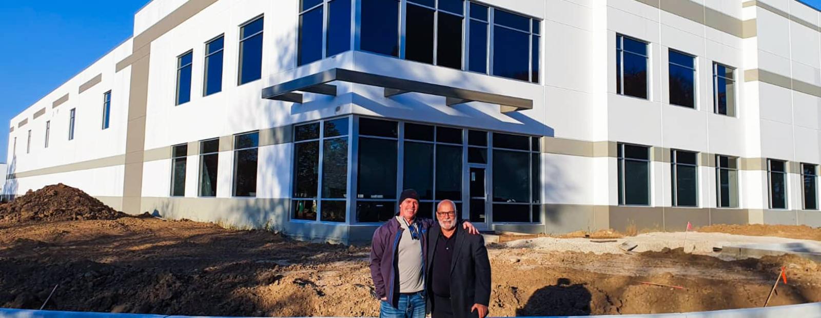 Felins is moving to a new building, the photo shows the new building with large windows and contrasting white exterior walls.