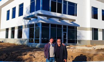 Felins is moving to a new building, the photo shows the new building with large windows and contrasting white exterior walls.